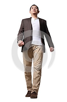 Full length portrait of Asian businessman wearing brown suit standing walking, front view low angle  profile