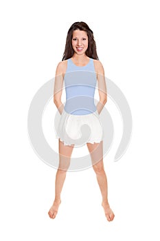 Full length portrait of an attractive brunette woman wearing a white skirt over a blue bathing suit