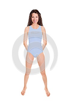 Full length portrait of an attractive cheerful woman wearing a blue bathing suit