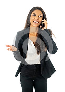 Full length portrait of Attractive latin corporate latin woman looking confident making a call on her mobile phone in Creative