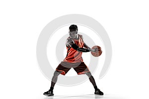 Full length portrait of a basketball player with ball