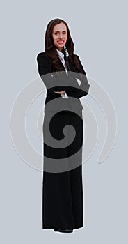 Full length portrait of a beautiful business woman standing with hands folded over white background.