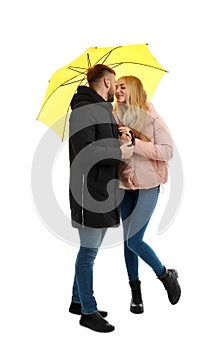 Full length portrait of beautiful couple with umbrella