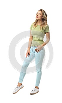 Full-length portrait of beautiful young woman on white background