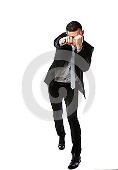 Full-length portrait of a businessman punching