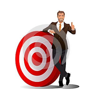 Full length portrait of a businessman standing next to a big target and showing thumbs up isolated on white background