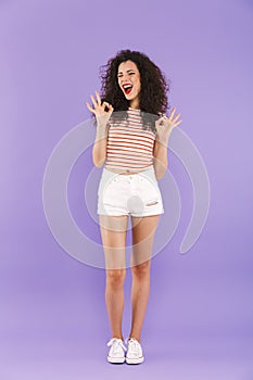 Full length portrait of caucasian teenage girl with curly hair i