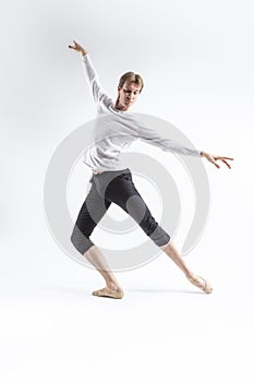 Full Length Portrait of Caucasian Young, Handsome, Sporty Athletic Ballet Dancer with Lifted Hands Over White