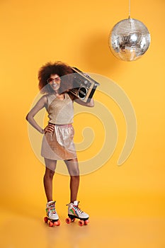 Full length portrait of cheerful african disco woman with hand o