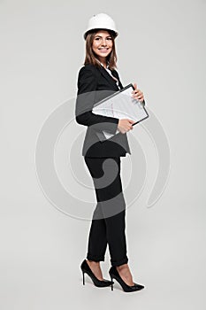 Full length portrait of a cheerful energetic woman