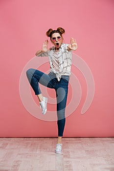 Full length portrait of a cheerful young girl