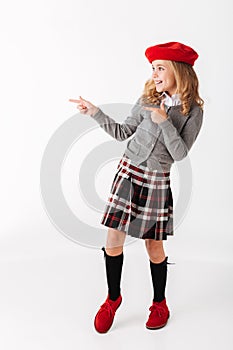 Full length portrait of a cheery little schoolgirl