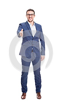 Full length portrait of confident businessman giving handshake greeting isolated on white background. Manager cheers coworker with