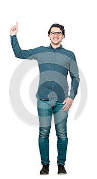 Full length portrait of contented businessman, pointing forefinger up isolated on white background with copy space. Joyful
