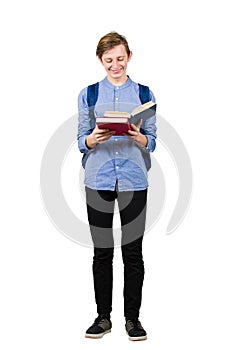 Full length portrait contented student boy enjoy reading his favorite book isolated over white background. Smiling happy teen guy