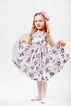 Full length portrait of a cute little dancing girl