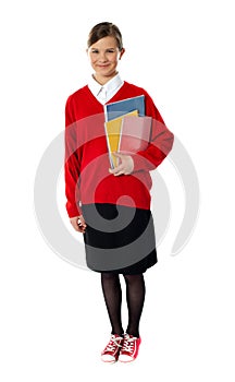 Full length portrait of cute schoolgirl