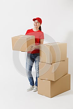 Full length portrait of delivery woman in red cap, t-shirt giving order boxes isolated on white background. Female