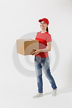 Full length portrait of delivery woman in red cap, t-shirt giving order boxes isolated on white background. Female