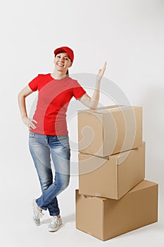 Full length portrait of delivery woman in red cap, t-shirt isolated on white background. Female courier or dealer