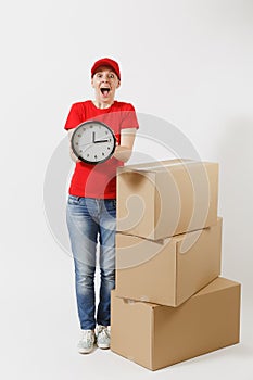 Full length portrait of delivery woman in red cap, t-shirt isolated on white background. Female courier near empty