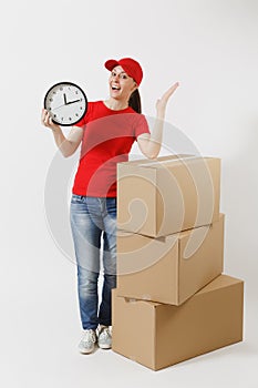 Full length portrait of delivery woman in red cap, t-shirt isolated on white background. Female courier near empty
