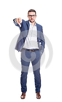 Full length portrait, discontent businessman looks angry showing thumb down gesture isolated on white background. Upset business