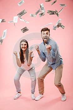 Full length portrait of an excited young couple