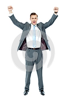 Full length portrait of a excited young executive