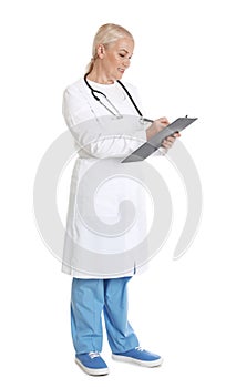 Full length portrait of female doctor with clipboard. Medical staff