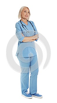 Full length portrait of female doctor in scrubs isolated on white