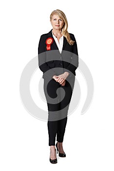 Full Length Portrait Of Female Politician Wearing Red Rosette photo