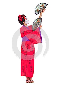 Full length portrait of geisha dancing with fans