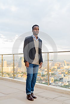 Full length portrait of handsome black African businessman