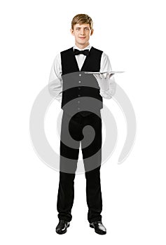 Full length portrait of handsome elegant waiter holding empty tr
