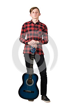 Full length portrait of handsome teenage guy posing with his favourite blue acoustic guitar isolated on white background. Music
