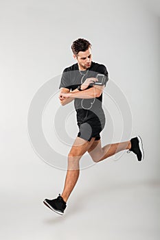 Full length portrait of a handsome young man athlete