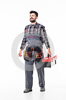 Full length portrait of a handyman with box isolated over white wall background