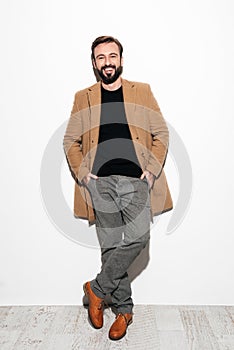 Full length portrait of a happy bearded man