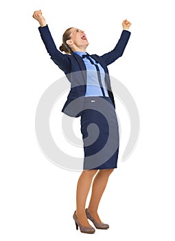 Full length portrait of happy business woman rejoicing success