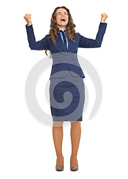 Full length portrait of happy business woman rejoicing success