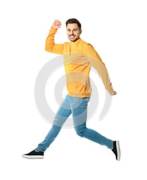 Full length portrait of happy handsome man jumping