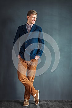 Full length portrait of happy handsome young man