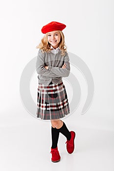 Full length portrait of a happy little schoolgirl