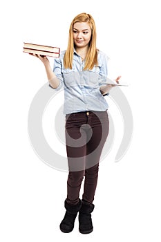 Full length portrait of happy teenage girl holding books in one
