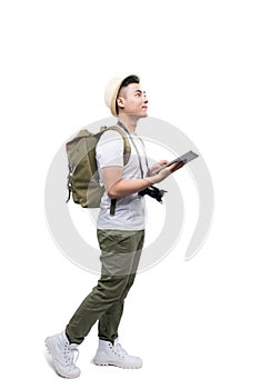 Full length portrait of happy tourist man using tablet on white