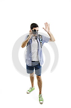 Full length portrait of happy tourist photographer man taking picture