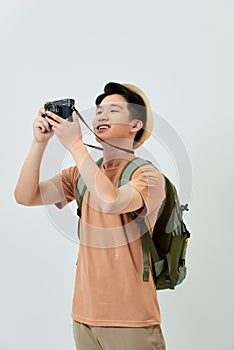 Full length portrait of happy tourist photographer man on white background. Travel blogger, tourist man