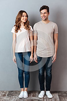 Full length portrait of a happy young couple standing