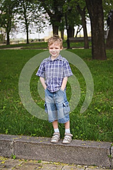 Full length portrait of little cute funny boy